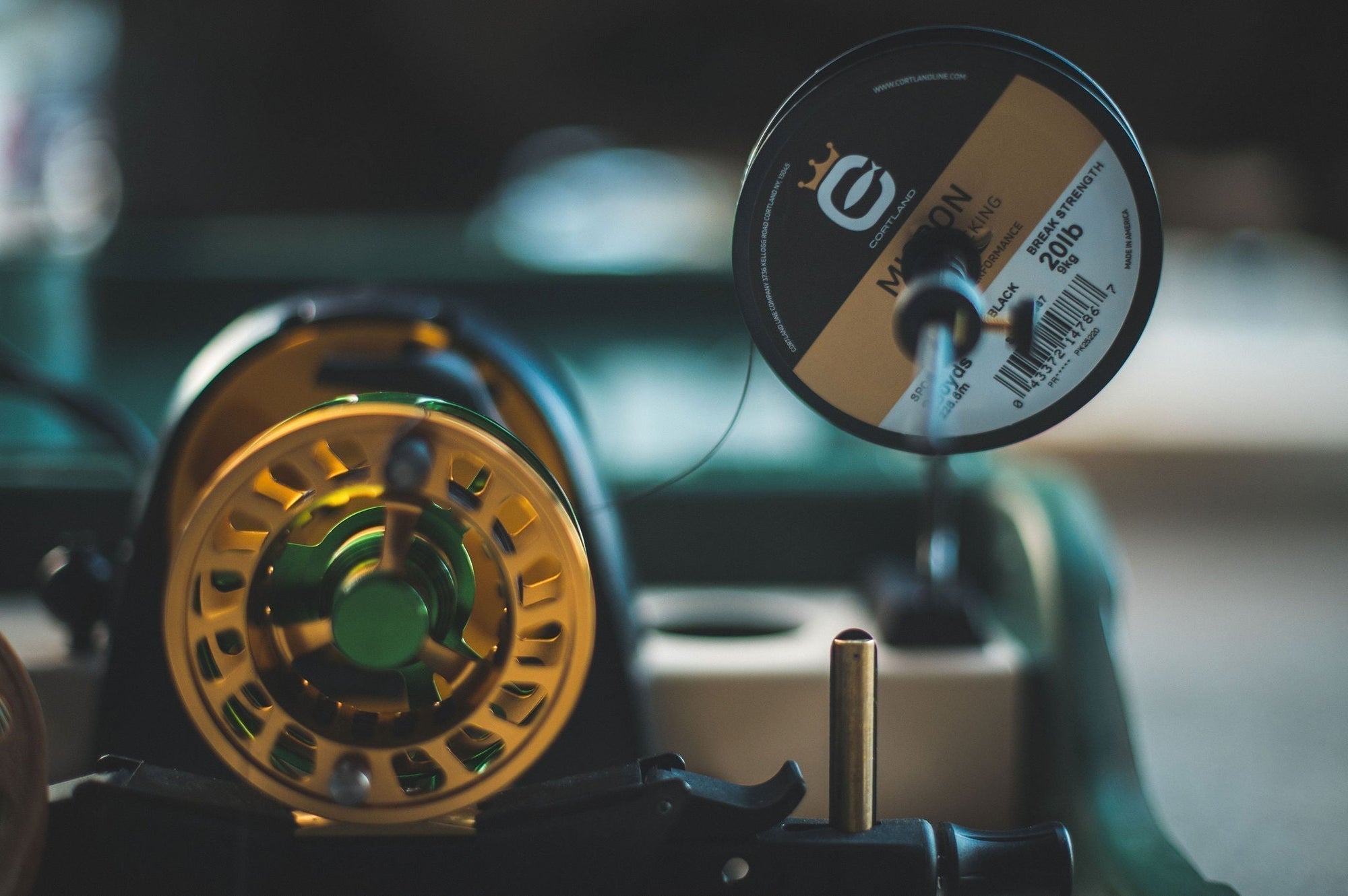 Fly fishing reel loaded with premium Cortland backing showing proper line stacking